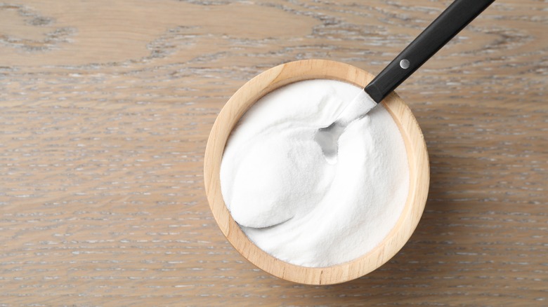 Bowl of baking soda with spoon