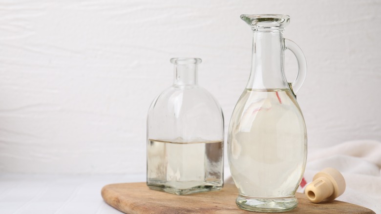 White vinegar in clear, glass bottles