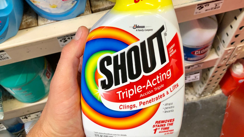 Holding Shout cleaner in store