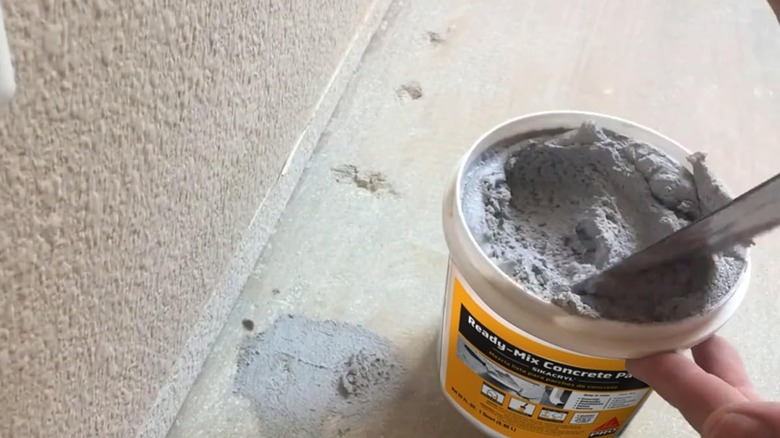 Applying Sika Ready-Mix Concrete Patch to concrete