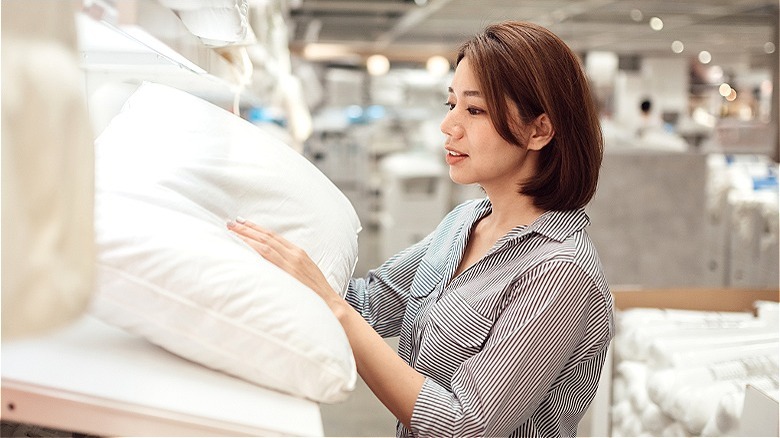 Person shopping for pillows