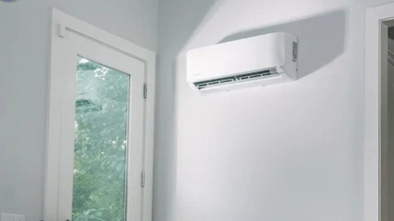 A MRCOOL brand mini split air conditioner installed high on a wall