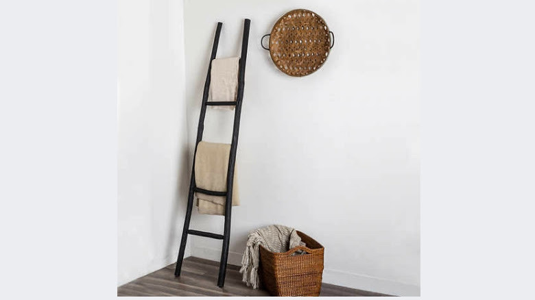 Decorative blanket ladder in corner 