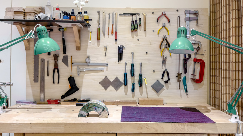 Wooden work bench with tools