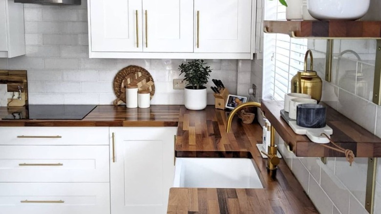 Wood countertops on white cabinets