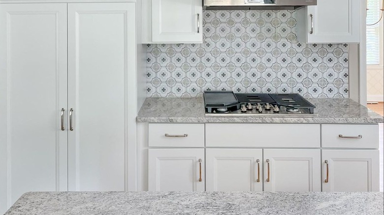 White cabinets with granite countertops