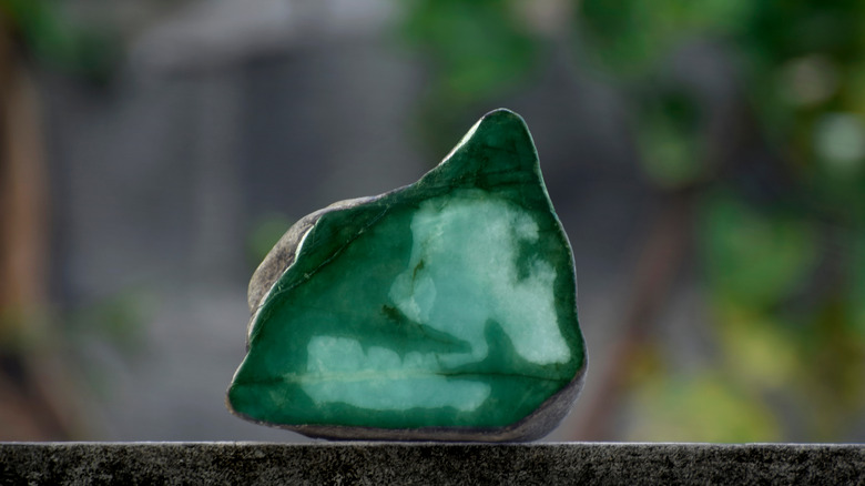 jade crystal on gray table