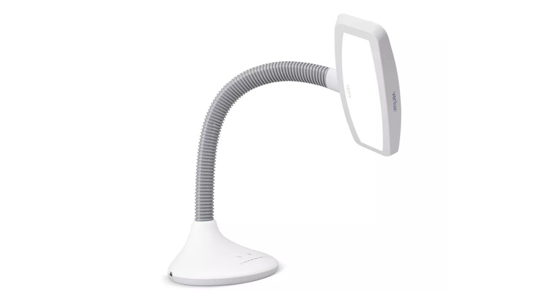 white lamp bent over