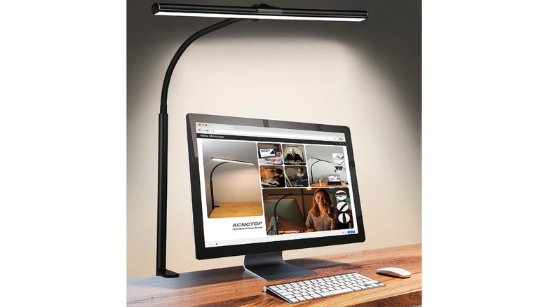 black clip lamp on desk