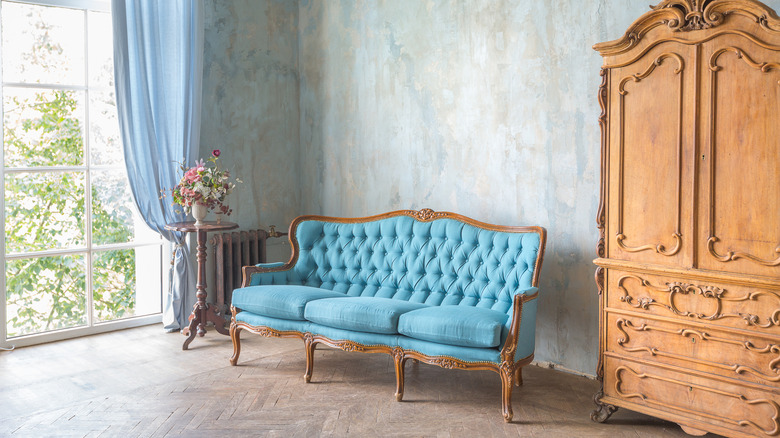 antique armoire next to sofa