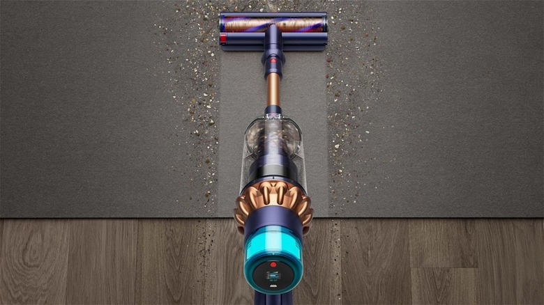 Dyson vacuum cleaning dirty rug