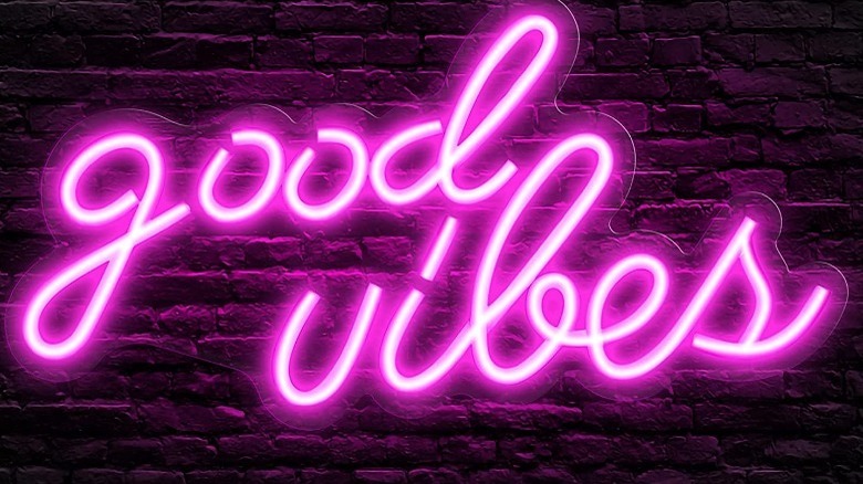 neon sign says good vibes