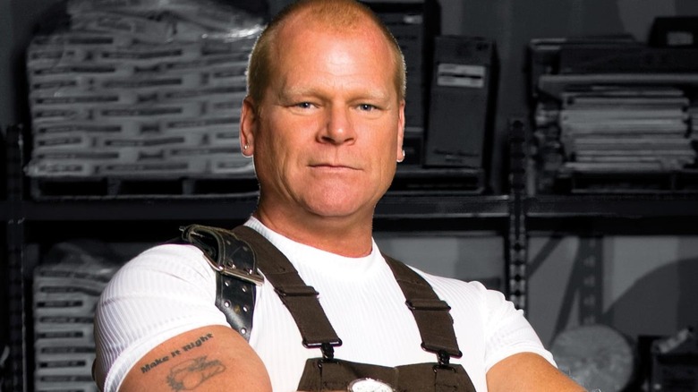 Mike Holmes posing with arms crossed