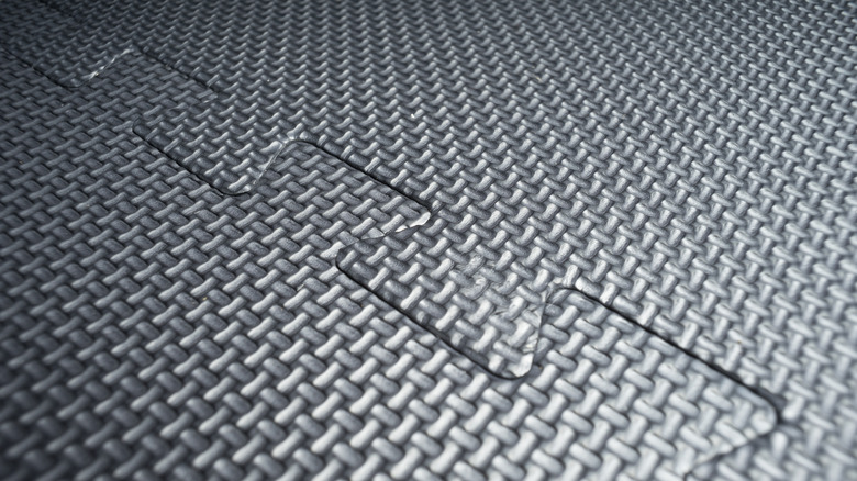 Interlocking PVC tiles on floor