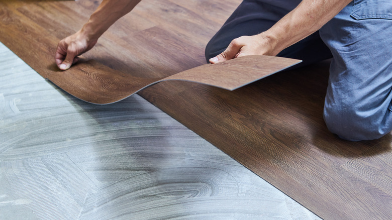 Person laying vinyl planks