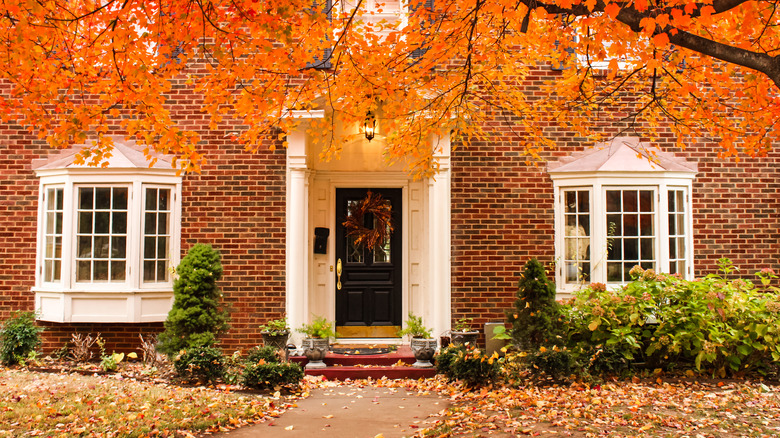 Red brick house with dark door