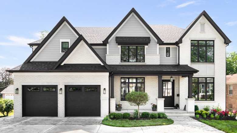 White brick house with black door