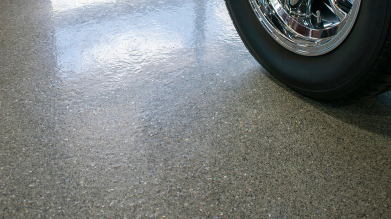 Epoxy coating on garage floor with car tire