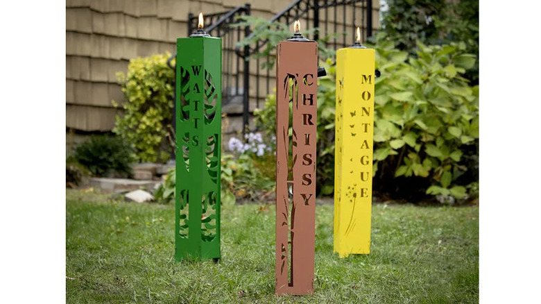 Three metal citronella lanterns