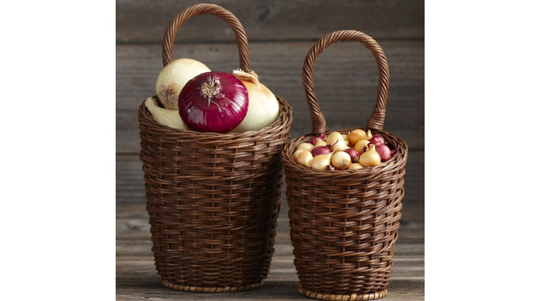 Two wicker baskets with onions