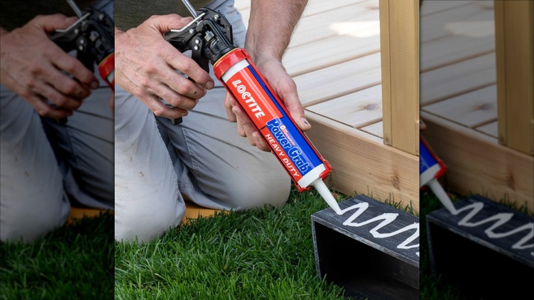 A person uses Loctite Power Grab on a small box