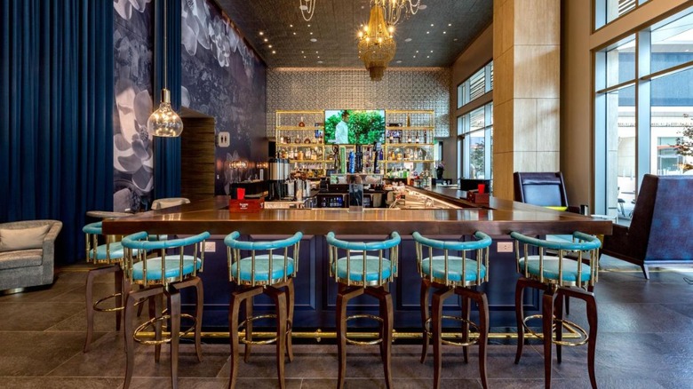 hotel bar with blue barstools 