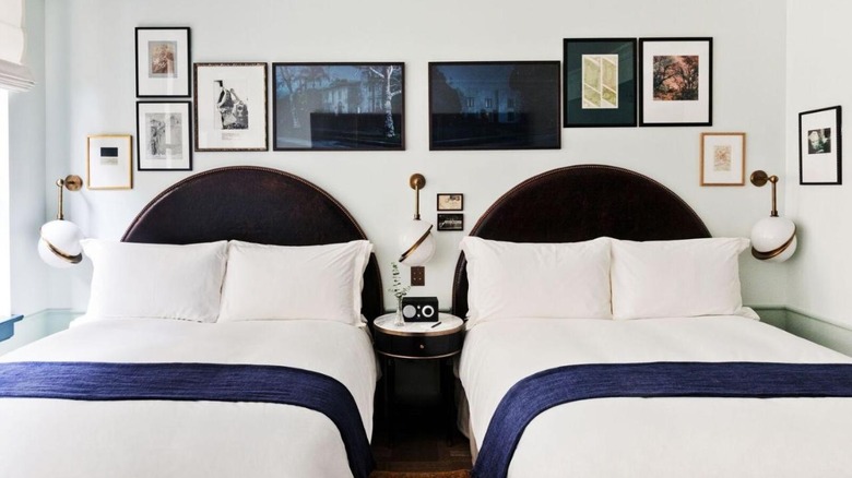 hotel beds with gallery wall