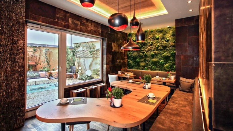 hotel dining area with green wall