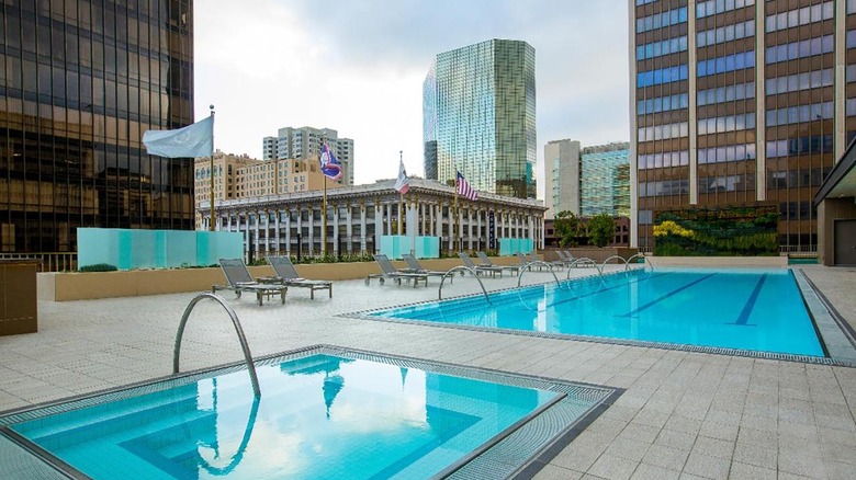 outdoor pool with city skyline 