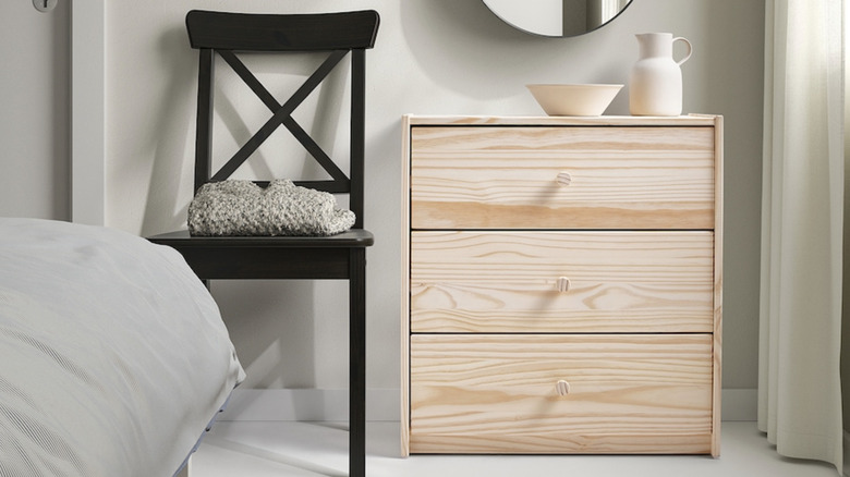 The RAST pine wood 3 drawer chest in a bedroom