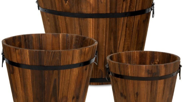 Three wooden bucket planters 