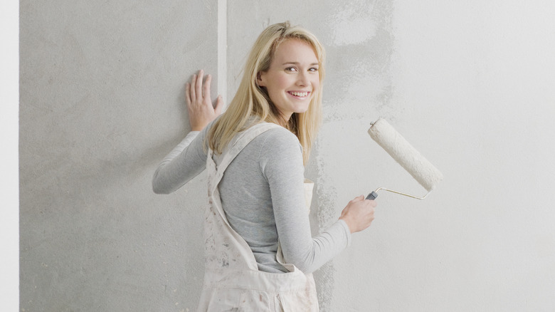 woman painting wall