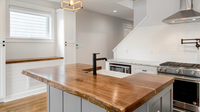 Kitchen with wood countertop and chiseled countertop edge