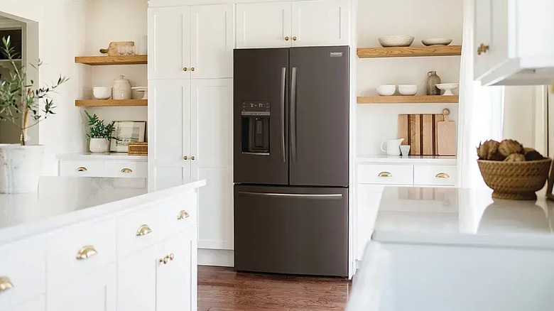 black french door refrigerator in white rustic modern kitchen