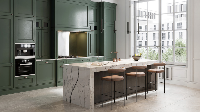 Green cabinets and marble countertop