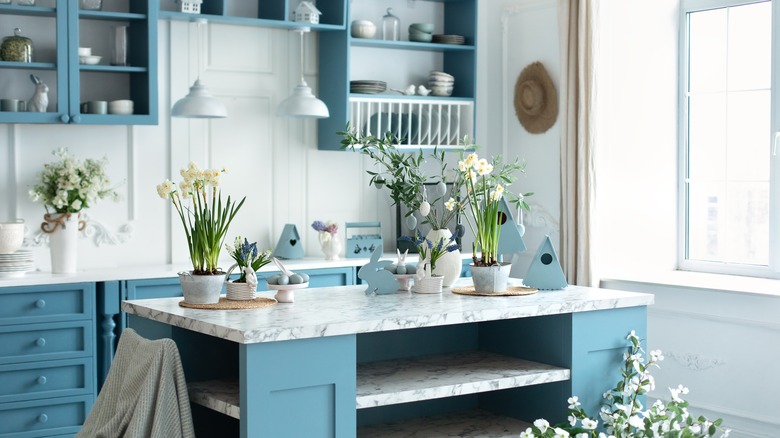 Blue kitchen with marble counters