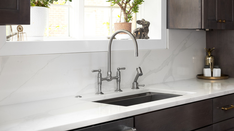 A high arc faucet over a kitchen sink