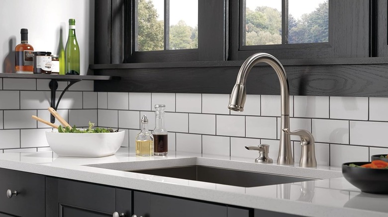 A Delta faucet over a sink