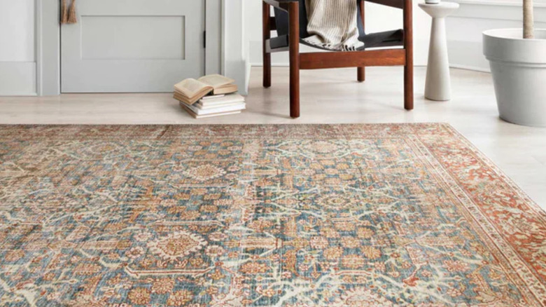 brown and blue floral patterned rug 