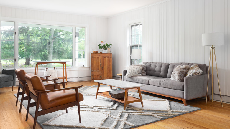 gray sofa on top of gray rug