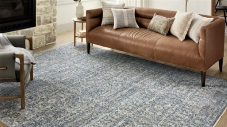 blue area rug under sofa