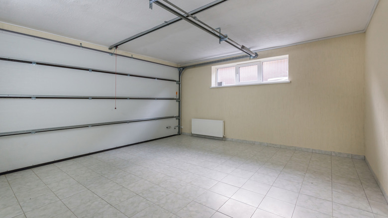 Interior of garage with tiled floor and small window