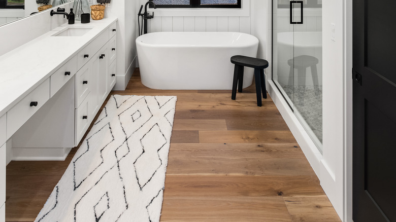 Contemporary bathroom with wood floors