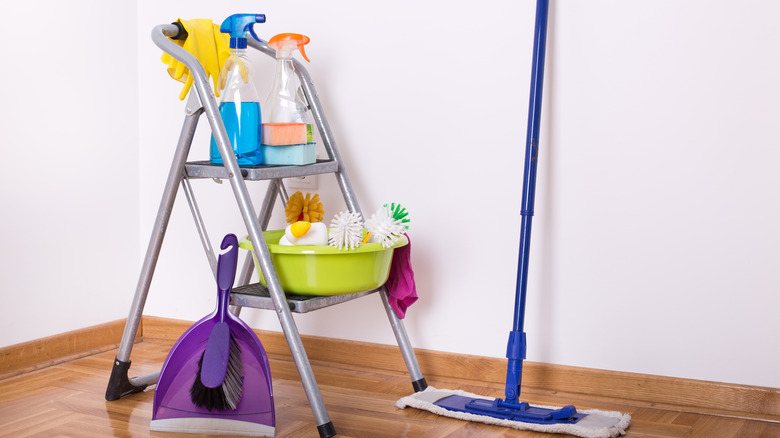 ladder and cleaning supplies