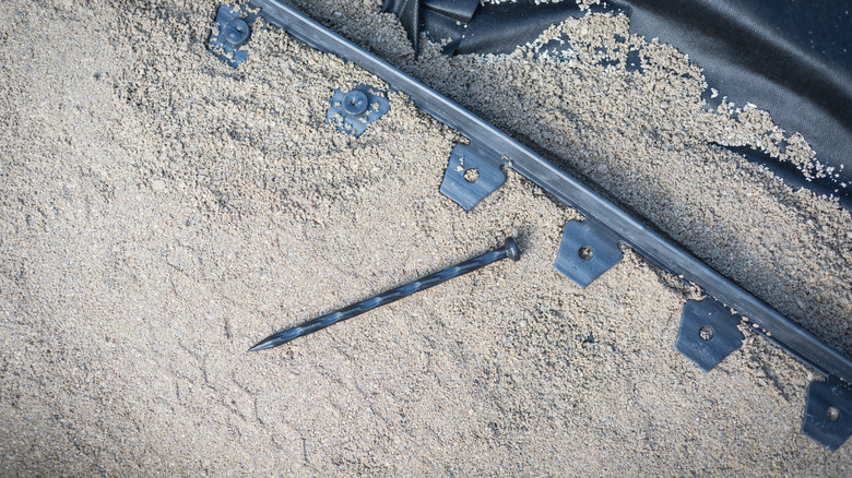 anchoring spikes next to edging