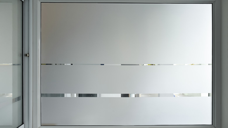 A minimalist frosted glass window film with horizontal lines through it