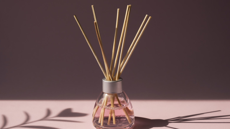 Reed diffuser in glass bottle