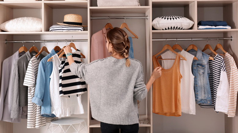 Woman arranging closet