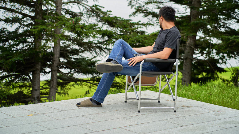 man out on concrete patio 