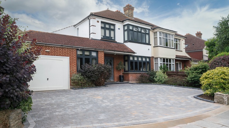 house with paved driveway